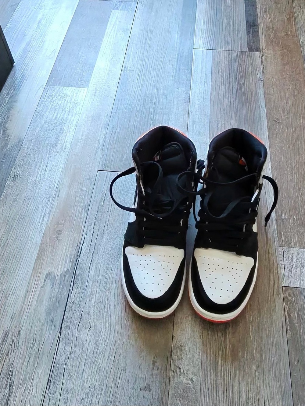 Jordan Black and White High-Top Sneakers with Red Accent